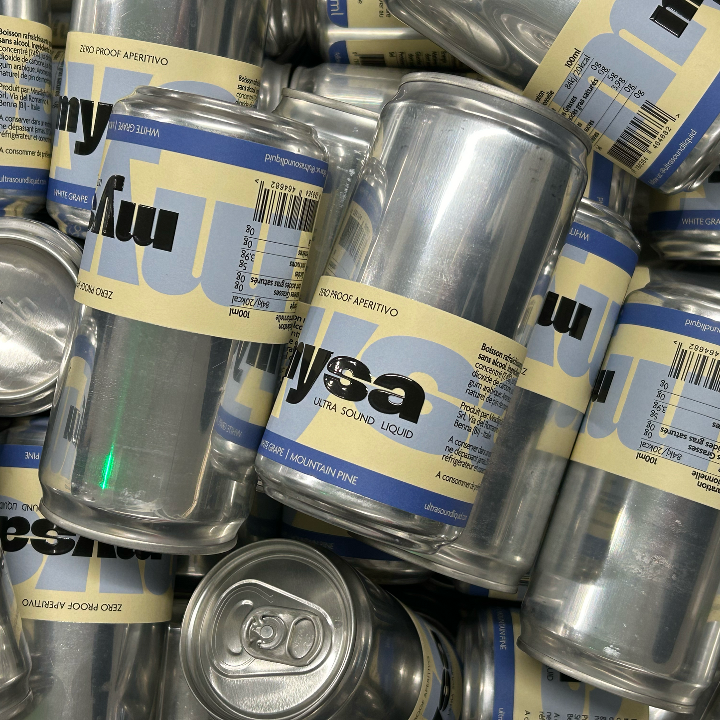 Pile of 250ml sleek metal cans with 'mysa' branding on labels
